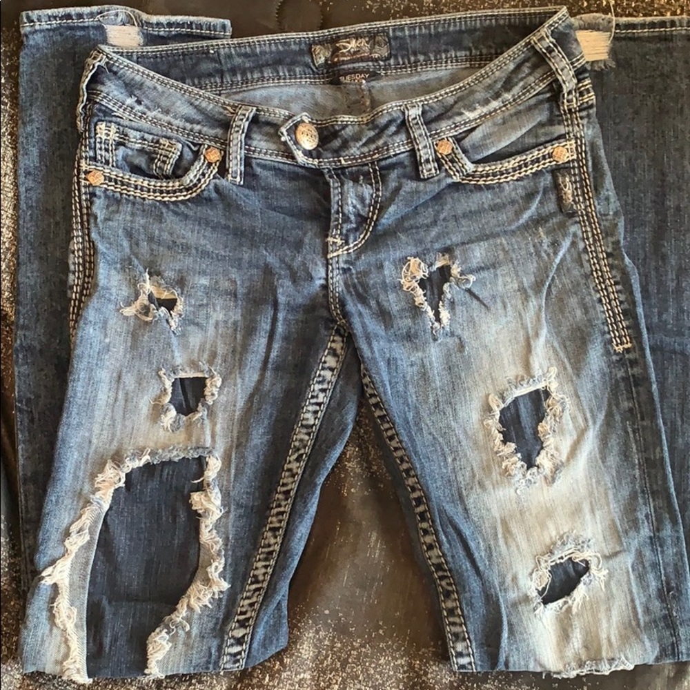 Distressed straight jeans.